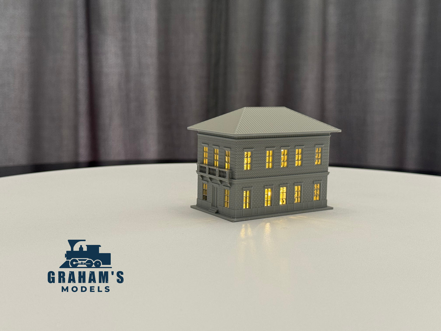 N scale small train station model by Graham’s Models, built and assembled, featuring detailed platform and station building.