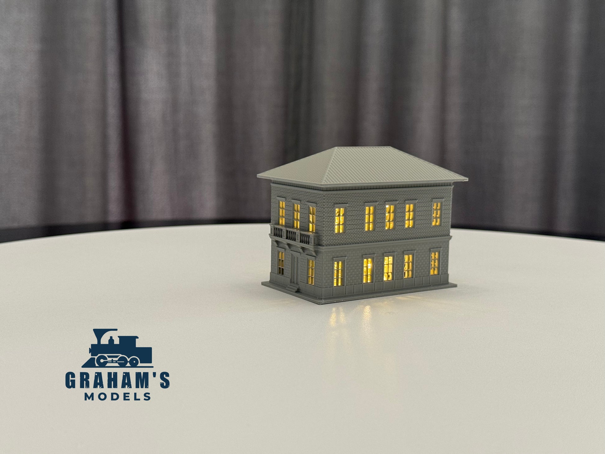 N scale small train station model by Graham’s Models, built and assembled, featuring detailed platform and station building.