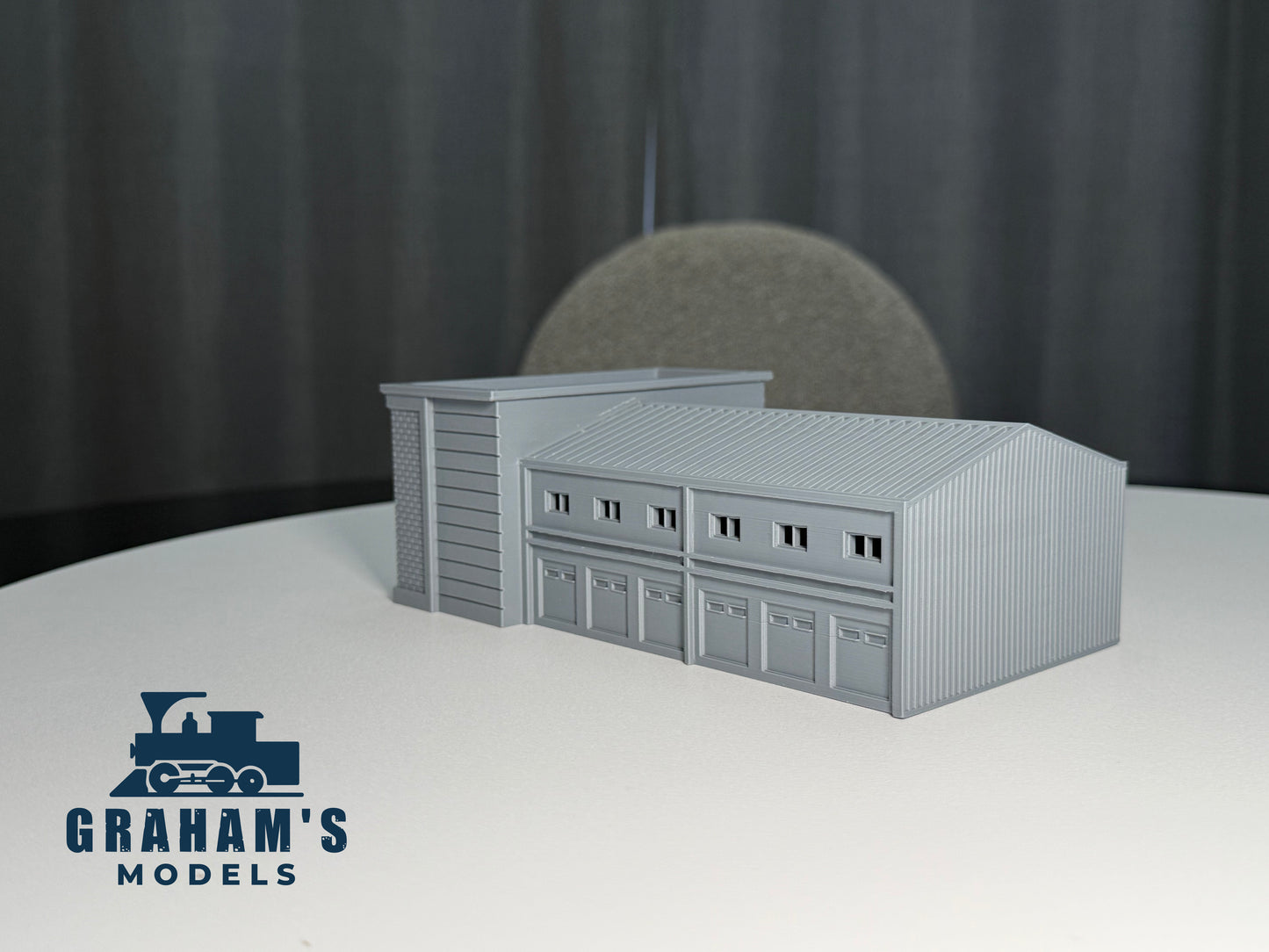 Preassembled N scale shipping logistics warehouse model in 1:160 gauge by Graham’s Models, detailed industrial building for model railroads.