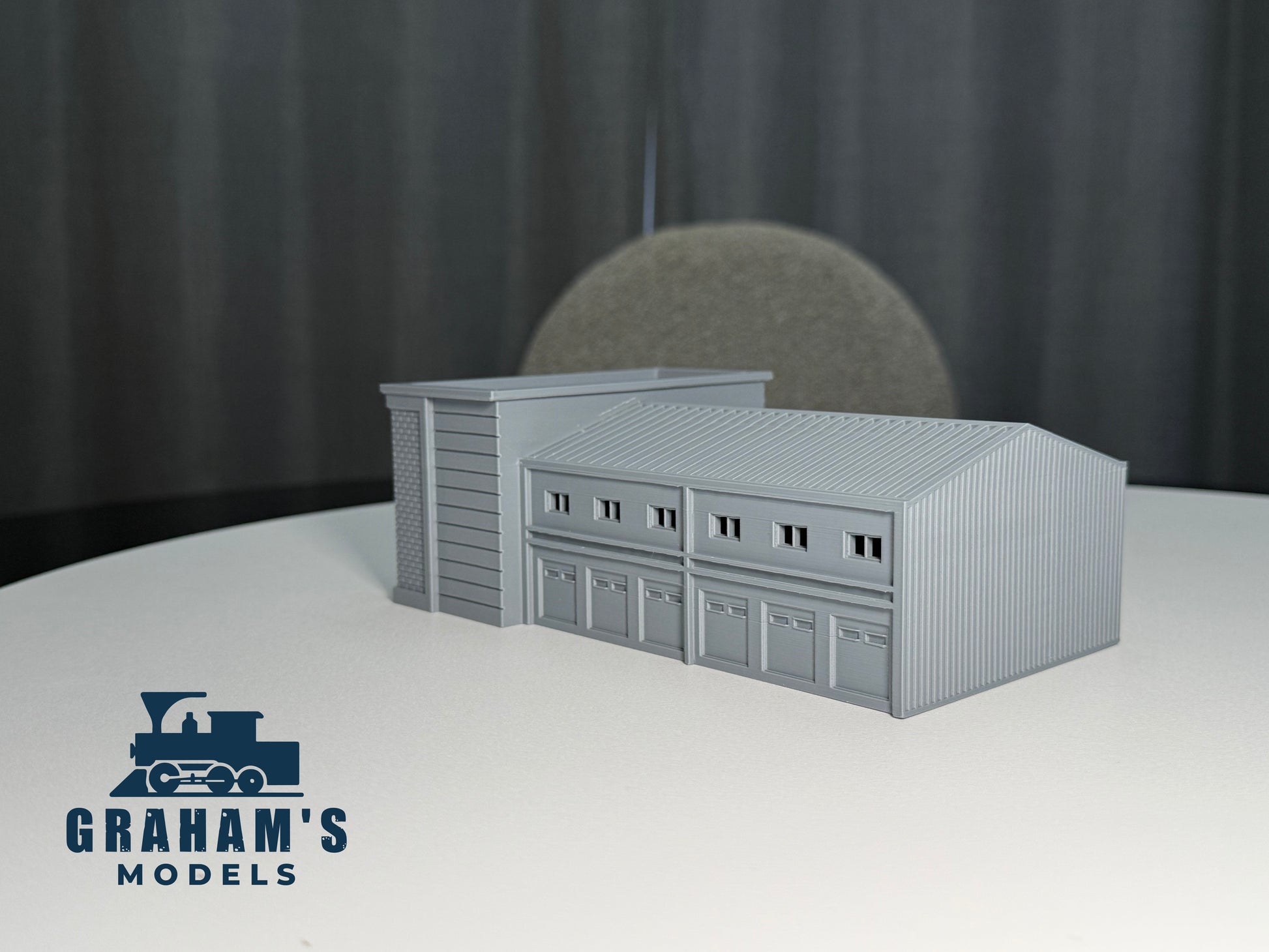 Preassembled N scale shipping logistics warehouse model in 1:160 gauge by Graham’s Models, detailed industrial building for model railroads.