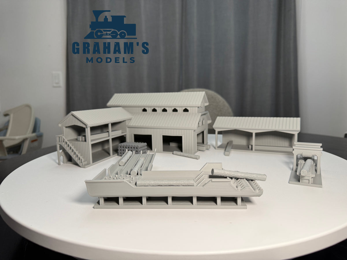 Preassembled HO scale sawmill lumber yard model by Graham’s Models, detailed miniature for 1:87 gauge model train layouts.