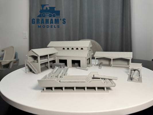 Preassembled HO scale sawmill lumber yard model by Graham’s Models, detailed miniature for 1:87 gauge model train layouts.