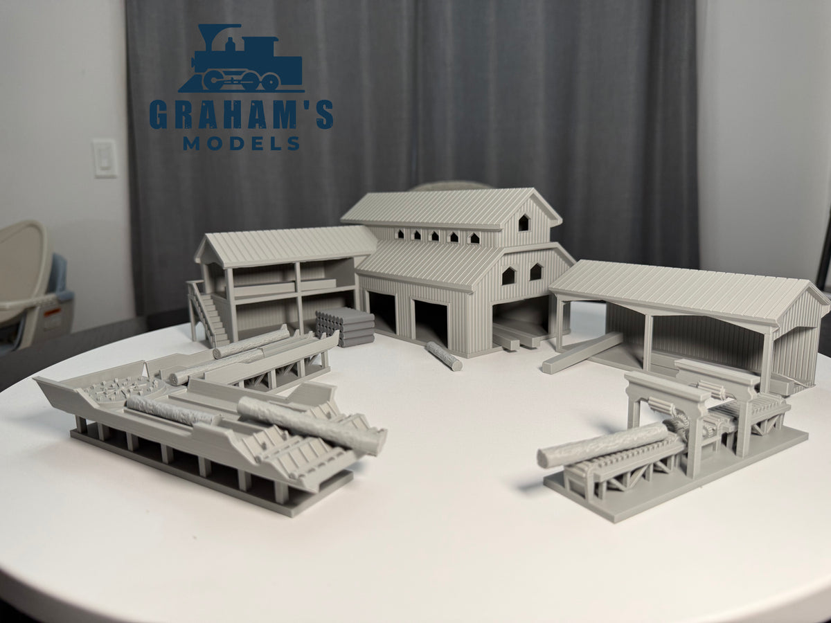 Preassembled HO scale sawmill lumber yard model by Graham's Models, detailed 1:87 gauge miniature for model railroad layouts.