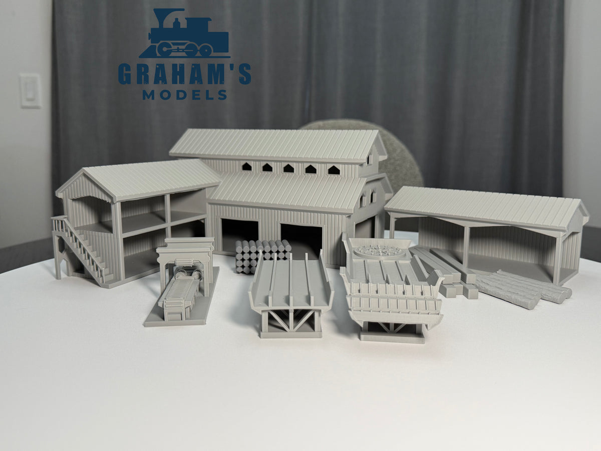 Preassembled HO scale sawmill lumber yard model by Graham’s Models, detailed 1:87 gauge miniature for model train layouts.